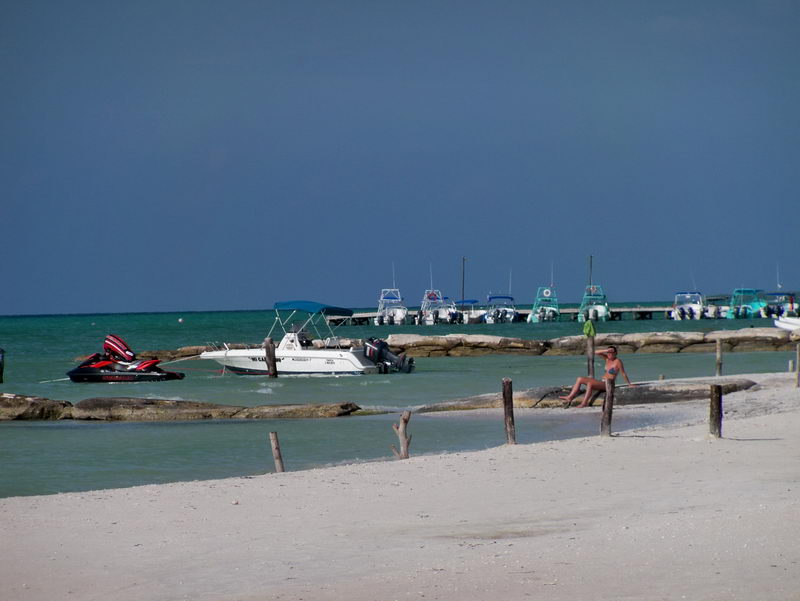 Pier at Holbox Island Gulf coast. boats for fishing or snorkeling